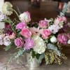 This arrangement is uniquely crafted with elegant pinks &amp; purples. Florals may