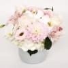A beautiful white arrangement with just a hint of light peach and