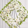Offer solace with a sentimental arrangement for the services. The square wreath
