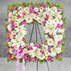 Offer solace with a sentimental arrangement for the services. The square wreath