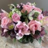 Roses, ranunculus, tweedia, tulips,hellebores, hydrangea and tweedia in shades of pink, white