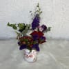 Cans full of love decorated with fresh seasonal flowers.