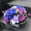 A compact arrangement perfectly scaled for a small desk, nightstand or side