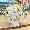 Brings a variety of white roses and other white florals, stock &amp;