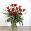 The product includes red roses, eucalyptus leaves and some green plants, in