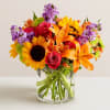 Like a comforting embrace, the vibrant arrangement expresses your warm condolences beautifully;
