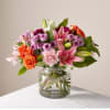This vibrant bouquet features roses, lilies, carnations &amp; more flowers to show
