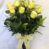 Beautiful long lasting premium yellow roses arranged in a clear vase with