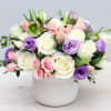 Pink roses with lisianthus, waxflower and stock flowers make this a chic