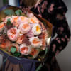 Certainly! Here&#039;s a description for a bouquet featuring Garden Roses and Eucalyptus:

Garden