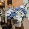 The composition shades of blue with gorgeous baby blue roses and orchids