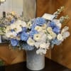 The composition shades of blue with gorgeous baby blue roses and orchids