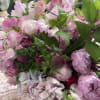 A lush, artful and sophisticated mix of high-end seasonal flowers in pink