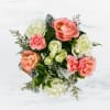 This arrangement includes pink roses, white roses, white spray roses, pink carnations