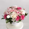The &quot;Pink Peonies Bliss Vase&quot; is a delightful arrangement that features a