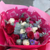a combination of red white and pink roses totaling 24, mixed with