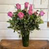 Picture-perfect soft pink roses make a beautiful gift for the lovely lady