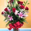 BEAUTIFUL ROSE ARRANGEMENT WITH STARGAZER LILIES.  YOU CAN ORDER 12, 24