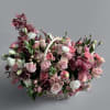 Fall in love with our stunning pink flower basket. This charming arrangement