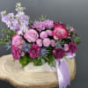 Lavender Fields is a mesmerizing floral arrangement that embodies the serene beauty