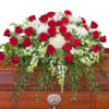 Red and white premium varieties of flowers combine with lush foliage to