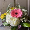 White hydrangea, pink gerber daisy, pink carnations, yellow alstroemeria combine to make