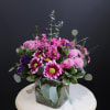 A fun name for a fun full of purple arrangement!