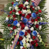 Standing tall, proud and patriotic, this dazzling free-standing spray is like a