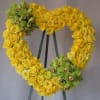 Open Heart easle arrangements with yellow roses and green orchids