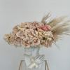 An exquisite flower arrangement that combines the timeless elegance of quicksand roses.