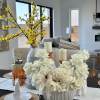 A sophisticated white rose arrangement nestled in a chic vase, perfectly balancing