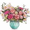 Evoking the beauty of dreams in color, this enchanting rose bouquet is
