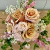 Blushing Betty is a sweet blush-colored arrangement of roses, spray roses, and