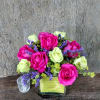 This stylish modern arrangement of hot pink and green roses just lovely