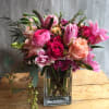 Hot pink roses with orchids and ranunculus. As Paris once said &quot;that&#039;s
