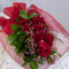 One Dozen Red Roses Accented Flower/  wrapped in clear paper &amp;