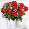 Our beautiful bouquet of red roses and gypsophila fills the air with