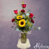 Sunflowers, roses and carnations in a vase with a little honeybee comb