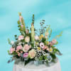 A serene angel in a garden of soft and soothing flowers. Angels