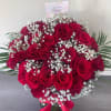 The product contains 48 roses with baby&#039;s breath in a glass vase