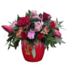 Crimson Bloom Delight is an exquisite arrangement featuring a striking red container