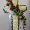 White Standing Cross with red roses roses. 