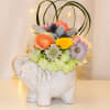 Ellie is a bright and cheery arrangement with a fun keepsake ceramic