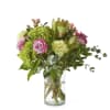 Bring the great outdoors, in hydrangeas, roses, eucalyptus, and hypericum berries.