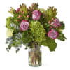 Bring the great outdoors, in hydrangeas, roses, eucalyptus, and hypericum berries.