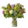 Bring the great outdoors, in hydrangeas, roses, eucalyptus, and hypericum berries.