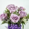 Show them you care with this pastel-colored arrangement filled with lavender blooms