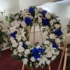 Large blue and white sympathy wreath. Perfect for a male&#039;s services. It