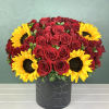 This striking arrangement showcases bold red roses paired with vibrant yellow sunflowers.