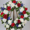 Red Roses, White Roses, White Mums,Blue Delphinium, Blue Thistle, Canterbury Bells, Pittosporum